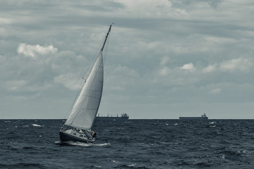 Wall Mural - Blue sailboat at storm