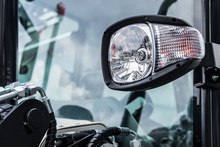 Headlights And Parking Lights Of A Truck, Excavator, Tractor Or Bulldozer Or Other Construction Equipment