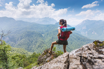 female hiker enjoying beautiful mountain view