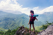 Female hiker enjoying beautiful mountain view