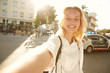 © Evgeny Lobanov - A girl making an emotional selfie at a crossroad in Barcelona