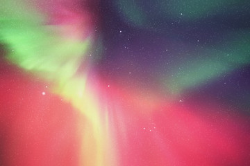 Night starry sky. Northern lights. Red green aurora borealis