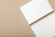 © fotofabrika - Blank paper pieces for mock up on a beige background