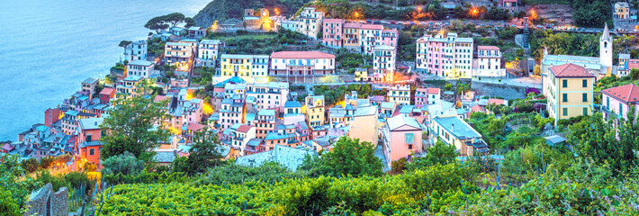 Wall Mural - beautiful evening panoramic view of riomaggiore in cinque terre, liguria, italy, europe.