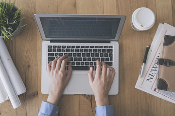 Young woman working on laptop computer