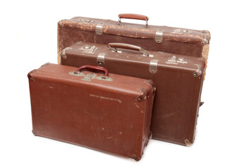 Ancient suitcase for travel on a white background