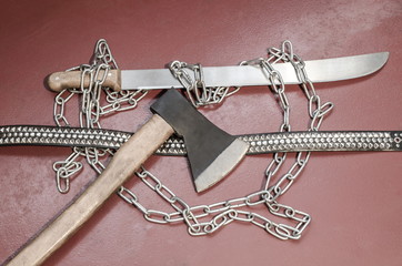 
Machete, chain, ax and belt with metal inserts-an attribute of a metal player.