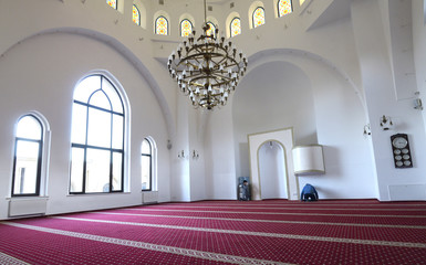 View of hall for praying (iwan) of the Ar-Rahma Mosque (Mercy Mosque) with minbar (pulpit). Just before celebrating nowruz (Turkic New Year). March 21, 2018. Kiev, Ukraine