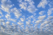 Background of beautiful  sky with clouds. Cirrocumulus. Looking up view. Close Up. Abstract natural  sky background.