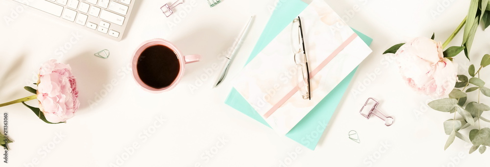 Flat lay women's office desk. Female workspace with laptop,  flowers peonies,  accessories, notebook, glasses, cup of coffee on white background. Top view feminine background.Copy space.banner - obrazy, fototapety, plakaty 