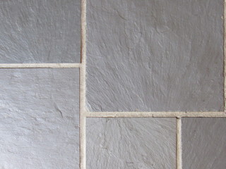 Large gray stone tiles with white seams 