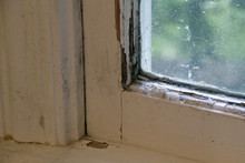 Old, Moldy Wood Window And Frame With Peeling Paint