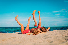 Little Boy And Girl Relax On Tropical Beach