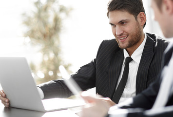 closeup.successful businessman with a colleague discussing work issues