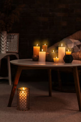 Canvas Print - Burning candles on table indoors