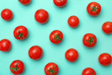 Flat lay composition with ripe tomatoes on color background