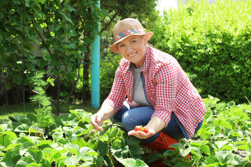 Woman working in garden on sunny day