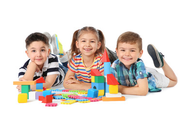 Canvas Print - Little children playing together on white background. Indoor entertainment