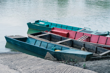 Various boats and small boats on the river bank