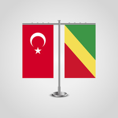 Table stand with flags of Turkey and Republic of the Congo.Two flag. Flag pole. Symbolizing the cooperation between the two countries. Table flags