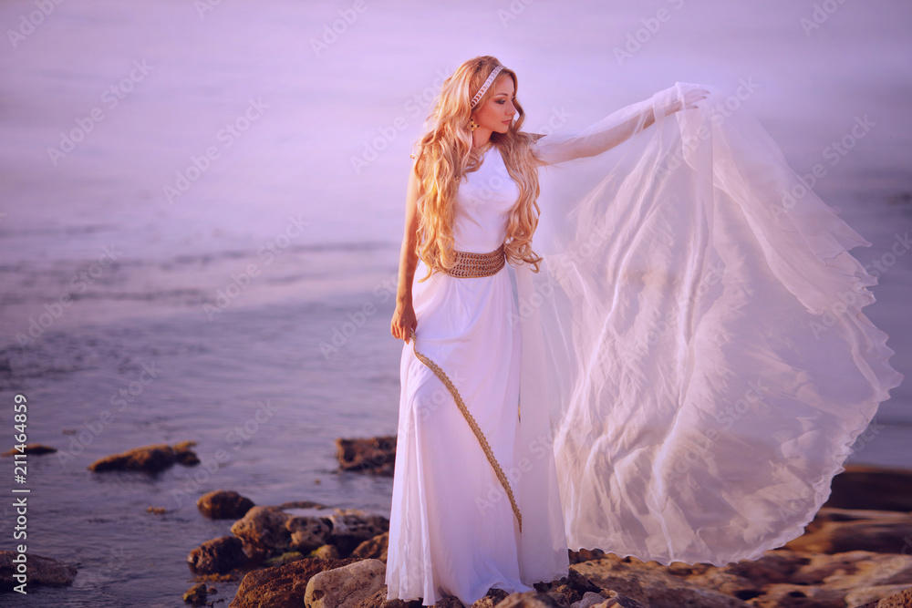 Beautiful girl in a long white wedding dress in Greek style is the old Greek goddess Stock Photo | Adobe Stock Beautiful girl in a long white wedding dress in Greek style is the old Greek goddess Stock Photo | Adobe Stock