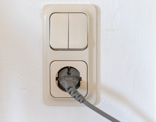 Double light switch and a socker inside in a house