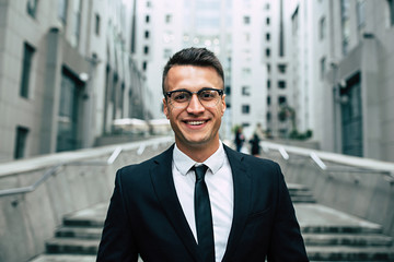 Happy success Business man in full suit outdoors