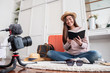 © weedezign - Asian young female blogger recording vlog video with vacation preparing to travel trip at home.online influcencer on social media concept.