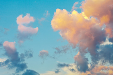 Wall Mural - blue sky and pink clouds at sunset in summer. heavenly landscape. natural background