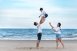 © ic36006 - Happy family on the beach. Parents with Children enjoying a holiday at the sea. Summer vacation concept