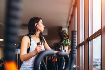 Wall Mural - Cute sporty girl workout in the gym