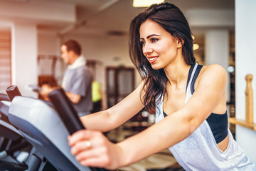 Cute sporty girl workout in the gym