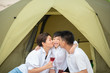 © ic36006 - Summer vacation. Family camping on beach with tent.