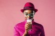 © Carlos David - Woman taking a sip out of a glass of milk