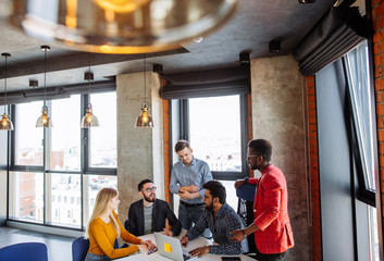 People Diversity, Teamwork, Brainstorming Togetherness Concept. Business Training Coach presenting seminar to uoung managers in modern loft office surroundings