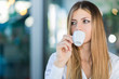 © Minerva Studio - Beautiful woman having a coffee in a cafe