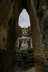 Buddha statue at Wat Si Chum, Sukhothai historical park, Thailand, Unesco world heritage.