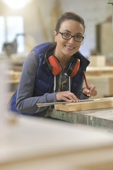 Wall Mural - Woman in professional training, wood industry