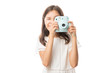 © AntonioDiaz - Portrait on a young girl clicking photos with camera isolated on white background