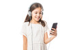 © AntonioDiaz - Busy smiling girl using smartphone and listening music in headphones isolated over white