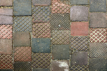 Wall Mural - pavement texture, medieval irregular sidewalk patchwork of square tiled cotto bricks