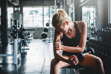 Woman Have Accident Injury And Hurt At Arms While Workout And Weight Training At Gym, Muscle Pain Concept