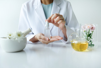 Wall Mural - the scientist,dermatologist testing the organic natural product in the laboratory.research and development beauty skincare concept.blank package,bottle,container .cream,serum.