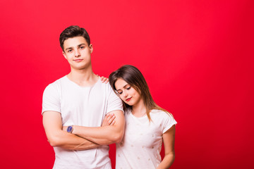 Sticker - Happy couple embracing and looking camera on red background