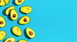 Fresh avocado pattern on a blue background flat lay