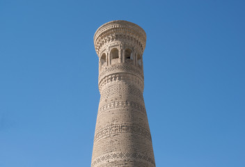 High oval tower of bricks, ancient Asian buildings. the details of the architecture of medieval Central Asia