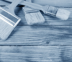 Brush painting paint on wooden background