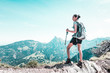 © XtravaganT - Athletic fit young woman hiking in the mountains