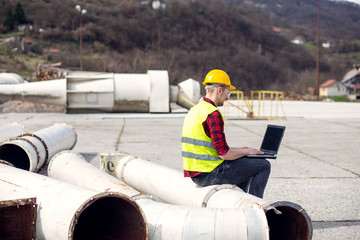 Wall Mural - Engineer working with laptop 