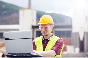 Wall Mural - Engineer working with laptop 